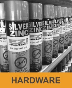 Black and White image of Ezimetal silver zinc paint bottle stacked in shelves